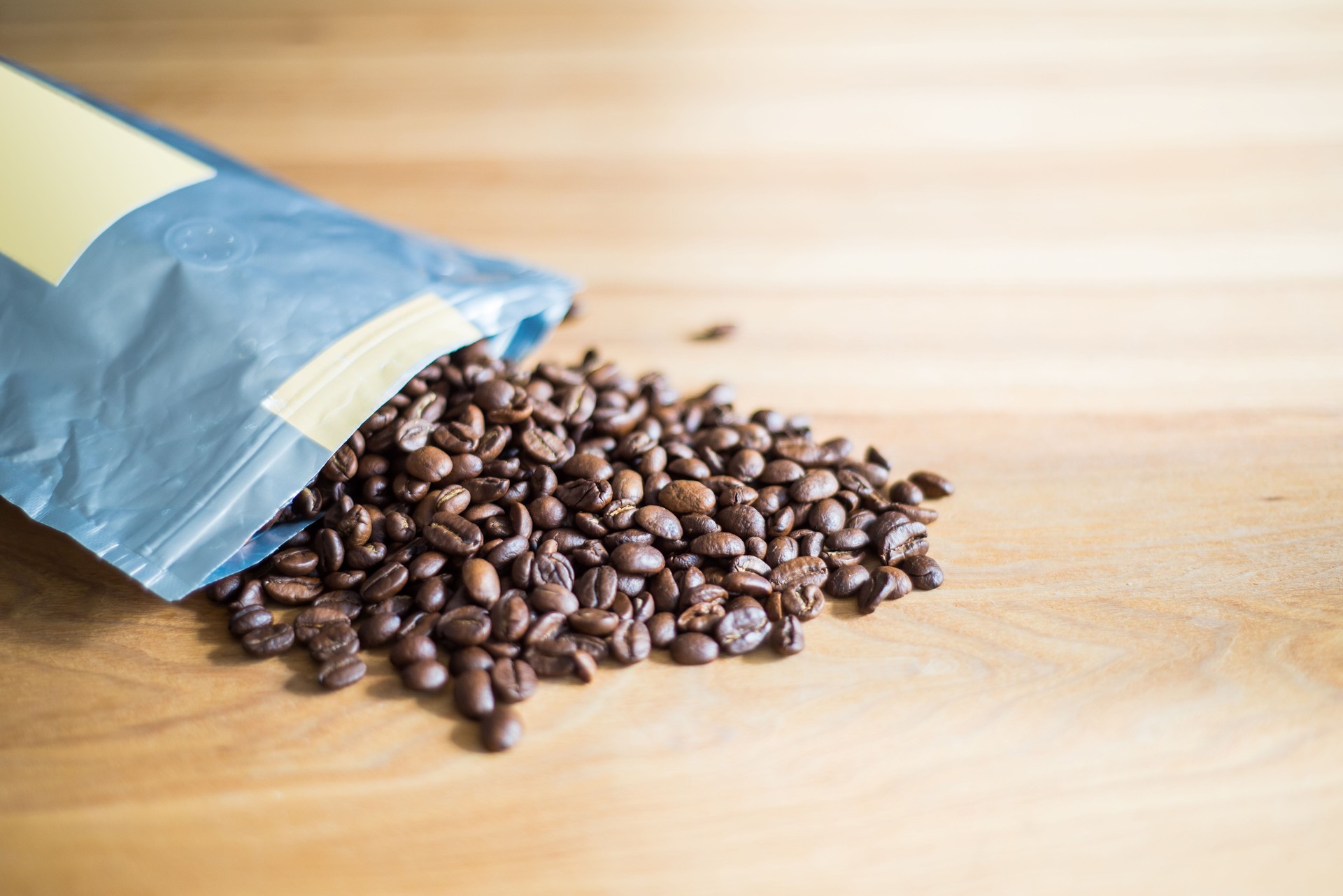 Coffee beans spilled from a pack